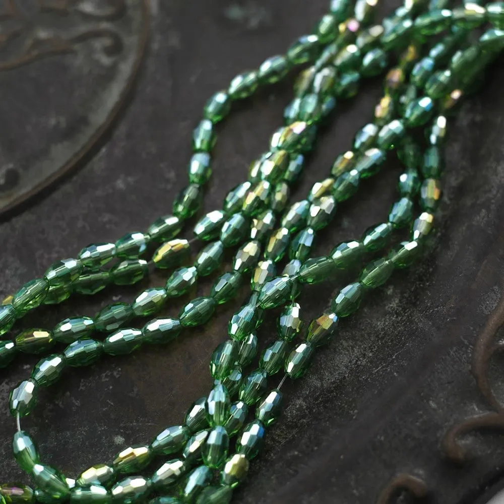 бусина, стекло овальная, граненая, цвет зеленый ав, 6х4 мм