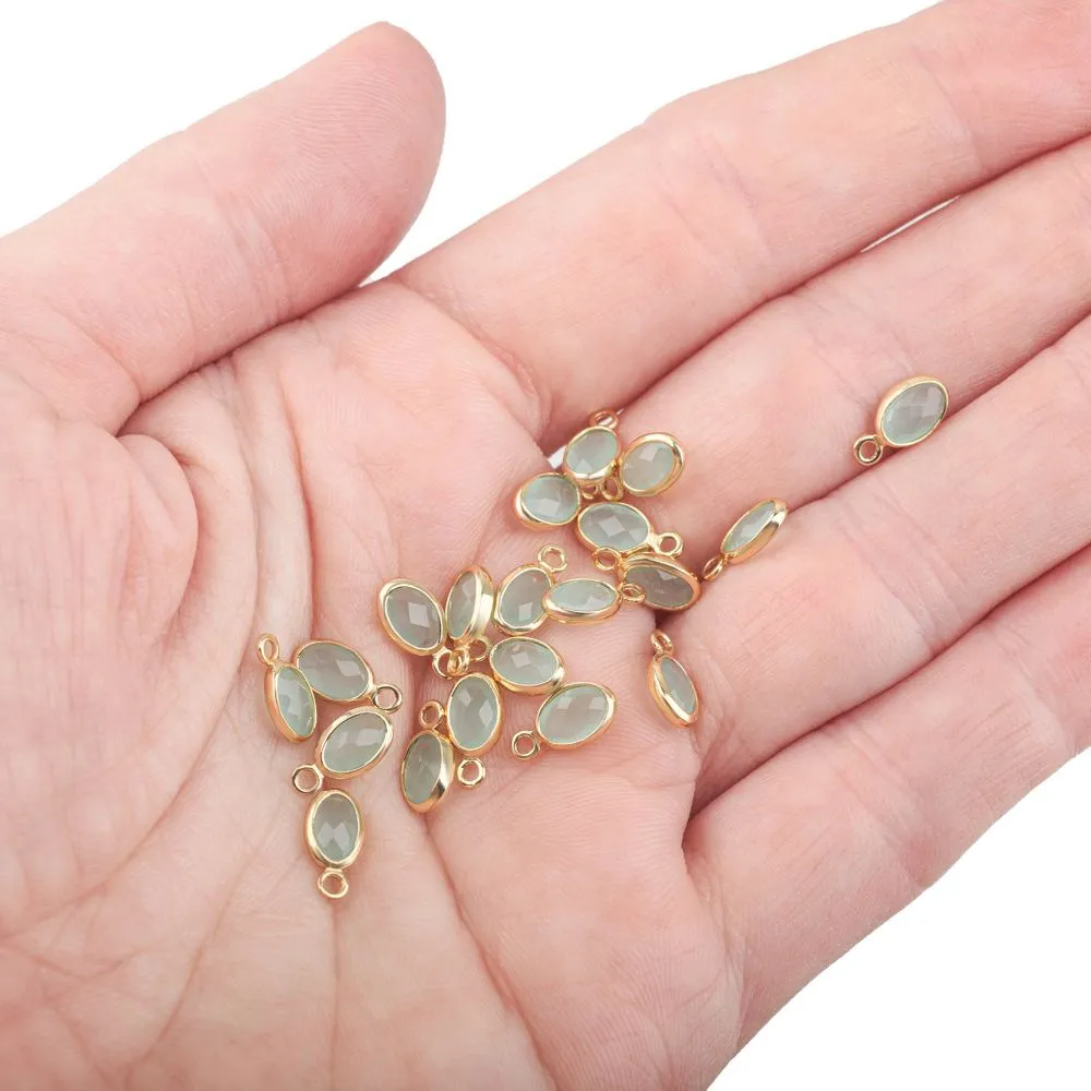 подвеска металл "эллипс", позолота/св.аквамарин, 9x4.5x2 мм