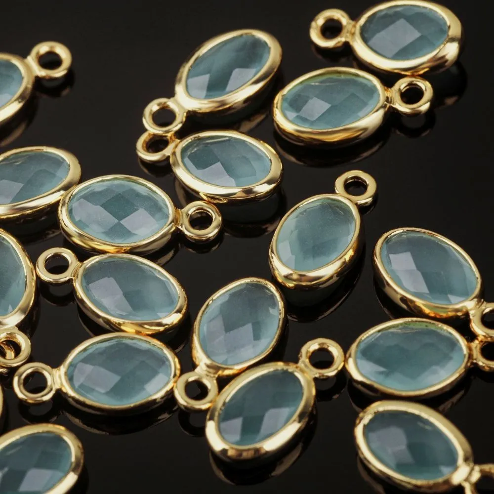 подвеска металл "эллипс", позолота/св.аквамарин, 9x4.5x2 мм